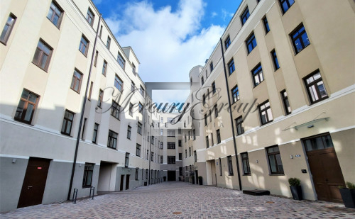 A house with its own parking lot and children's playground in the heart of Riga